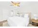 Bright bedroom with ceiling fan and ensuite bathroom at 11816 Park Rd, Charlotte, NC 28226