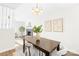 Bright dining area with a wood table and four chairs at 11816 Park Rd, Charlotte, NC 28226