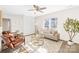 Light-filled living room with a modern aesthetic and fireplace at 11816 Park Rd, Charlotte, NC 28226