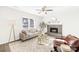 Living room with fireplace, neutral decor, and hardwood floors at 11816 Park Rd, Charlotte, NC 28226