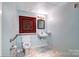 Small bathroom with toilet and sink at 119 S Lee St, Salisbury, NC 28144