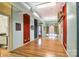 Long room with hardwood floors and colorful accent walls at 119 S Lee St, Salisbury, NC 28144