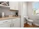 Simple half bathroom with white toilet and vanity at 11936 Fiddlers Roof Ln, Charlotte, NC 28277