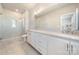 Modern bathroom with double vanity and a large shower at 11936 Fiddlers Roof Ln, Charlotte, NC 28277