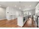 Modern kitchen with island and stainless steel appliances at 11936 Fiddlers Roof Ln, Charlotte, NC 28277