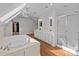 Elegant bathroom with soaking tub, double vanity, and skylights at 1212 Ridge St, Albemarle, NC 28001