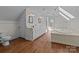 Bathroom with double vanity, jacuzzi tub, and skylights at 1212 Ridge St, Albemarle, NC 28001