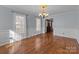 Spacious dining room with hardwood floors and chandelier at 1212 Ridge St, Albemarle, NC 28001