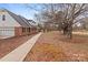 Side view of the house showcasing landscaping and walkway at 1212 Ridge St, Albemarle, NC 28001