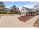 House exterior with a large driveway and backyard at 1212 Ridge St, Albemarle, NC 28001