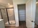 This bathroom features a glass shower and a large closet at 12131 Plummer Ct # 1, Midland, NC 28107