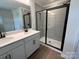 This spacious bathroom has double sinks and a glass shower at 12131 Plummer Ct # 1, Midland, NC 28107