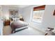 Bedroom with queen bed and large window overlooking backyard at 12131 Plummer Ct # 1, Midland, NC 28107