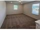 Spacious bonus room with neutral carpet, and two windows providing ample natural light at 12131 Plummer Ct # 1, Midland, NC 28107