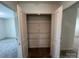 Walk-in closet features ventilated shelving units, providing optimal storage and organization at 12131 Plummer Ct # 1, Midland, NC 28107