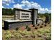 Midland Crossing community entrance sign with stonework and landscaping at 12131 Plummer Ct # 1, Midland, NC 28107