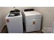 Functional laundry room equipped with modern washer and dryer units for convenience at 12131 Plummer Ct # 1, Midland, NC 28107