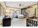 Bright room with ceiling fan, nature wall mural, and stylish furnishings at 12201 Pine Valley Club Dr, Charlotte, NC 28277