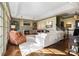 Spacious living room with fireplace, built-ins, a white sofa and natural light at 12201 Pine Valley Club Dr, Charlotte, NC 28277