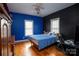 Blue and black bedroom with hardwood floors at 1270 Mirror Lake Rd, Lincolnton, NC 28092