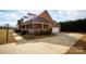 Brick home with a side view showcasing the attached garage and porch at 1270 Mirror Lake Rd, Lincolnton, NC 28092