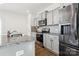 Modern kitchen with stainless steel appliances and granite countertops at 128 Mooring Dr, Statesville, NC 28677