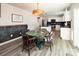 Modern kitchen with white cabinets, an island, and chalkboard wall at 131 Crownpiece St, Troutman, NC 28166