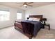 Spacious main bedroom with comfortable sleigh bed and window at 131 Crownpiece St, Troutman, NC 28166