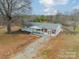 Aerial view of the property showcasing its landscaped front yard at 1486 Amity Church Rd, Denver, NC 28037