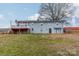 View of the rear exterior with deck and lawn space at 1486 Amity Church Rd, Denver, NC 28037