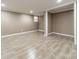 Recently finished basement with new wood-look tile floor and neutral wall paint at 1486 Amity Church Rd, Denver, NC 28037