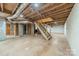 Spacious unfinished basement features a concrete floor, exposed ceiling, and stairs to the upper floor at 1486 Amity Church Rd, Denver, NC 28037