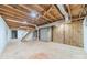 Unfinished basement featuring exposed ceiling, concrete floor, and stairs to the upper floor at 1486 Amity Church Rd, Denver, NC 28037