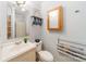 Bathroom with white vanity, medicine cabinet, shower, and magazine rack at 1486 Amity Church Rd, Denver, NC 28037