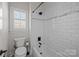 Clean bathroom with a shower/tub combo and subway tile at 15409 Brem Ln, Charlotte, NC 28277