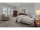 Cozy bedroom with a queen-size bed and ample natural light at 15409 Brem Ln, Charlotte, NC 28277