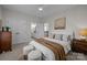 Well-lit bedroom with a king-size bed and en-suite bathroom at 15409 Brem Ln, Charlotte, NC 28277