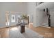 Two-story entryway with hardwood floors and a large chandelier at 15409 Brem Ln, Charlotte, NC 28277