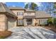 Two-story brick home with a metal roof and shutters at 15409 Brem Ln, Charlotte, NC 28277