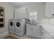 Convenient laundry room with washer, dryer, and extra storage at 15409 Brem Ln, Charlotte, NC 28277