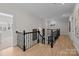 Bright upstairs hall with hardwood floors and elegant railing at 15409 Brem Ln, Charlotte, NC 28277