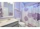 Modern bathroom with a lavender color scheme and a white vanity at 16303 Cozy Cove Rd, Charlotte, NC 28278