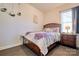 Cozy bedroom with a wooden bed frame and neutral color palette at 16303 Cozy Cove Rd, Charlotte, NC 28278