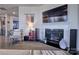 Living room with a modern fireplace and built-in shelving at 16303 Cozy Cove Rd, Charlotte, NC 28278