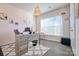 Modern home office with large window, desk, and stylish decor at 16303 Cozy Cove Rd, Charlotte, NC 28278