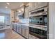 Modern kitchen with stainless steel appliances and gray cabinets at 16303 Cozy Cove Rd, Charlotte, NC 28278