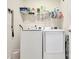 Clean laundry room with washer, dryer, and ample shelving at 16303 Cozy Cove Rd, Charlotte, NC 28278