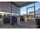 Relaxing screened porch with wicker chairs and backyard view at 16303 Cozy Cove Rd, Charlotte, NC 28278