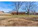 Large backyard with mature trees and a wooden fence at 1691 Montevista Dr, Shelby, NC 28150