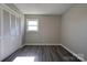 Bedroom with double-door closet and wood-look floors at 1691 Montevista Dr, Shelby, NC 28150